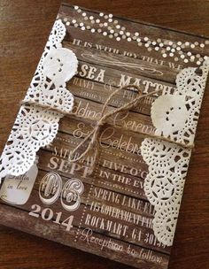 a wooden box with some paper cut outs on it, and an image of the wedding date