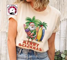 Merry Beachmas shirt,Funny Christmas in july shirt,Santa in July tshirt,Tropical Christmas shirt,Summer Christmas t shirt,Hawaian Santa top https://etsy.me/349fSXd  PRODUCT DESCRIPTION Please check the colors and sizes on the images! .: Retail fit .: 100% Soft cotton (fibre content may vary for different colors) .: Light fabric (4.2 oz/yd² (142 g/m .: Tear away label .: Runs true to size Machine wash: warm (max 40C or 105F); Non-chlorine: bleach as needed; Tumble dry: low heat; Iron, steam or dr Beach Season Holiday Cotton T-shirt, Beach Holiday Cotton T-shirt, Graphic Print T-shirt For Beach Holiday, Beach Holiday Graphic Print T-shirt, Cotton T-shirt For Beach Holiday, Fun Holiday Beach Tops, Fun Beach Season Holiday Tops, Fun T-shirt For Beach Season Holiday, White T-shirt For Beach Holiday