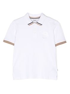 white cotton blend piqué weave embroidered logo at the chest stripe trim polo collar front button placket short sleeves short side slits straight hem White Polo Shirt With Polo Collar For Summer, White Polo Shirt For Summer, White Summer Polo Shirt, White Polo T-shirt With Striped Collar, White Collared Polo Shirt For Summer, White Short Sleeve Polo Shirt With Ribbed Collar, White Collared Polo Shirt, Summer Polo Shirt With Contrast Collar And Short Sleeves, White Cotton Polo Shirt With Striped Collar