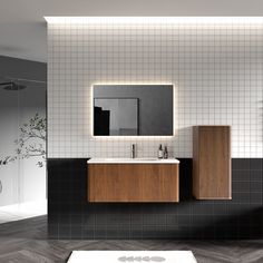 a bathroom with a sink, mirror and tiled walls