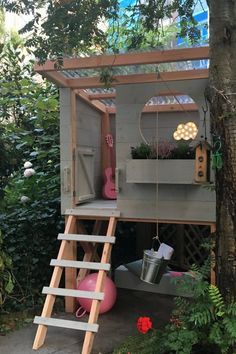 a small tree house built into the side of a tree