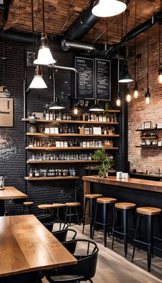 the interior of a coffee shop with wooden tables and stools