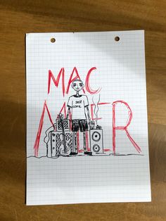 a piece of paper with the words mac miller written in red ink on top of it