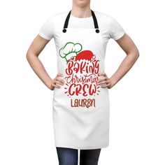 a woman wearing an apron with the words being christmas crew written on it, standing in front of a white background