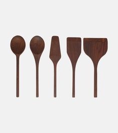 five wooden spoons lined up next to each other