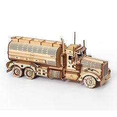 a wooden model of a semi - truck on a white background with no people around it