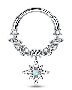 a piercing ring with a star design and crystal stones on the end, in white gold