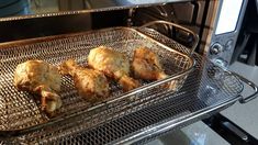 some chicken is cooking in an oven