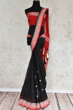 Black georgette chiffon saree with red banarasi border and pallu. Modern saree with ethnic look.-full view Elegant Black Saree With Border, Bollywood Style Black Saree With Border, Black Diwali Saree With Border, Black Dupatta With Border In Traditional Drape, Black Saree With Border For Festivals, Black Saree With Border Detail, Black Georgette Saree For Festivals, Black Georgette Traditional Wear, Black Georgette Traditional Wear For Festivals