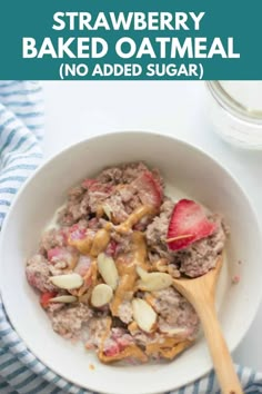 strawberry baked oatmeal in a white bowl with a wooden spoon on top