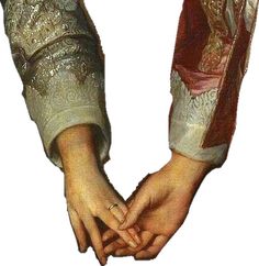 two hands holding each other with their fingers