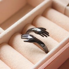 This adorable hand shaped hug ring is perfect for you or as a gift to a friend. It is adjustable, so no need to worry about getting your friends size right, but sturdy enough for day to day wear. Gold and Silver version also available. Adjustable Stainless Steel Midi Rings As Gift, Adjustable Black Midi Rings For Gift, Ring Gold And Silver, Black Statement Ring, Hug Ring, Black Minimalist, Ringe Gold, Minimalist Ring, Ring Black