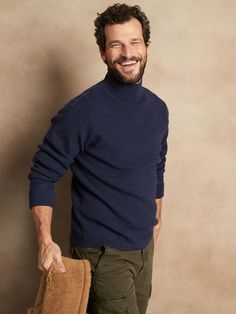 Inspired by sweaters worn by members of the Navy through the 1940s and 1950s, this classic turtleneck has a chunky ribbed knit stitch for extra warmth and comfort.  3-SEASON WARMTH: Soft and cozy, our designers chose this 12-gauge Merino wool yarn for it's midweight warmth so you can layer it through the seasons.  RELAXED FIT: Almost oversized.  Dropped shoulder.  Turtleneck.  Allover ribbed knit stitch.  Straight hem.  Relaxed fit.  Long sleeves.  Hip length.  Body length (size M): Regular 27", Men's Affordable Sweater With Ribbed Cuffs, Navy Wool Sweater Men, Turtleneck Outfit Men, Blue Outfit Men, Navy Blue Outfit, Sweater Outfits Men, Deep Winter Colors, Knit Sweater Outfit, Turtle Neck Men