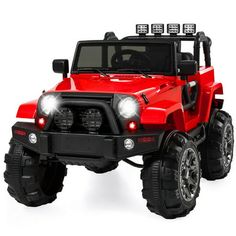 a red toy truck with four wheels and lights