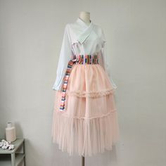 This is a Korean Modern Hanbok wrap style layered tulle see -through cover skirt for Women. This product is especially made with traditional Korean hanbok sewing techniques, so it is a sturdy skirt even after a long time. This hanbok is modernly designed so you can wear it comfortably and beautifully. This skirt, like a really luxurious piece of art, will make your special day even more beautiful. This modern hanbok is perfect dress for daily and celebrations such as parties or various events. ⭐ Spring Party Organza Skirt, Layered Party Skirt, Layered Long Skirt For Party, Fitted Organza Skirt For Spring, Spring Organza Dress With Long Skirt, Spring Long Organza Dress, Layered Skirt For Spring Party, Spring Long Organza Skirt, Party Wrap Skirt With Ruffles