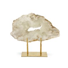 The Natural Geode Slice features a gentle sparkle, crisp white color, and unique texture that adds a dazzling touch of nature to any home or office. Sourced in the Atlas Mountains in Morocco, Each piece is unique and hand polished to create this wonderful work of nature. It's fit beautifully on a modern living room mantle, on a rustic great room shelf, or in an eclectically decorated bedroom. Variations in shape and texture may exist due to natural factors Golden Iron base Stylish Way To Add A T Rustic Great Room, Decorated Bedroom, Living Room Men, Living Room Mantle, Room Shelf, Geode Slice, Quartz Geode, The Atlas, Burke Decor