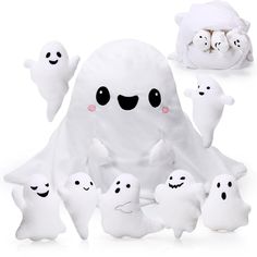 a group of ghost stuffed animals sitting next to each other