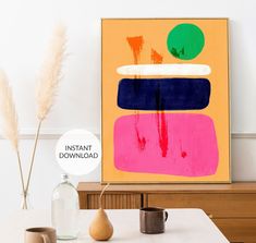 an abstract painting is displayed on the wall next to two vases and a plant