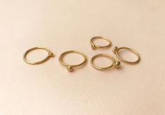 Bell rings. by Studio Baladi Stackable Midi Rings In Recycled Gold As Gift, Handmade Elegant Midi Rings With Round Band, Stackable Midi Rings In Recycled Gold For Gifts, Elegant Handmade Midi Rings With Round Band, Gift Stackable Midi Rings In Recycled Gold, Handmade Minimalist 14k Gold Filled Ring, Handmade Dainty Rings In Recycled Gold, Minimalist Handmade Rings In Recycled Gold, Handmade Everyday Rings With Round Band