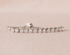 "This is an original design by me! I've created this beautiful bracelet using Swarovski crystals set in a row for a delicate and dainty look. This bracelet is easily adjustable by moving the slide up or down on the bracelet chains. This is the perfect gift for your flower girl . . . one that she'll enjoy long after your special day! Crystal focal measures 2.5\" long and 3/16\" wide. Child's bracelet expands to approximately 7.5\" to fit over hand. Please message me with any questions! Thank you Crystal Diamond Bracelet As A Gift, Crystal Diamond Bracelet With Sparkling Stones As Gift, Crystal Diamond Bracelet For Gifts, Crystal Diamond Bracelet As Gift, Sparkling Diamond Crystal Bracelet As Gift, Sparkling Diamond Crystal Bracelet For Gift, Diamond Jubilee Bracelet In Crystal For Gift, Sparkling Diamond Crystal Bracelet Gift, Gift Crystal Diamond Bracelet With Jubilee Design