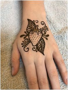 a hand with a henna tattoo on it