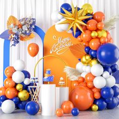 an assortment of balloons and decorations for a birthday party