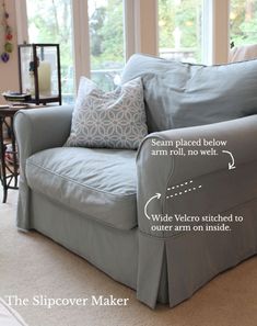 a couch with two pillows sitting on top of it