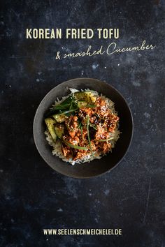 korean fried tofu and smashed cucumbers served in a bowl on top of rice