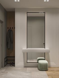 a bathroom with a bench, mirror and coat rack