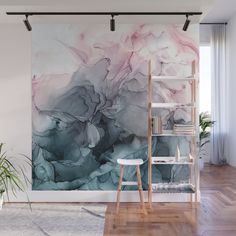 an abstract painting on the wall in a living room