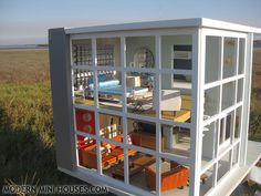 the inside of a doll house with furniture in it