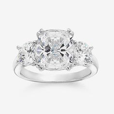 three stone engagement ring with diamonds