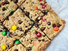 the cookie bars are decorated with m & m's and chocolate chip candies