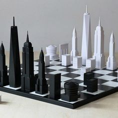 a black and white chess board with skyscrapers on it