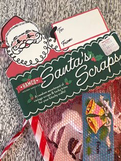 the santa's scraps gift bag is on display