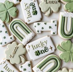 st patrick's day decorated cookies with shamrocks and lucky one written in white