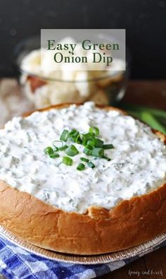 an easy green onion dip in a bread bowl