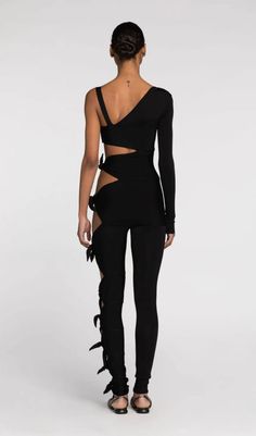 This show-stopping piece is all about making a statement and embracing your inner fashionista. The daring cut-outs add a touch of edgy charm, while the single-sleeve design adds a playful twist. Whether you're hitting the dance floor or attending a sparkling night event, this jumpsuit guarantees you'll be the life of the party. Gentle Dry Clean Only Colour may vary due to lighting on images. The product images (without model) are closest to the true colour of the product.Item runs true to size c Black One-sleeve Party Top, Black Fitted One-sleeve Top, Black Cutout Top For Evening, Black Cutout Evening Tops, Sparkling Night, Midi Pencil Dress, Life Of The Party, Denim Mini Dress, Jumpsuit With Sleeves