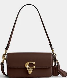 COACH Glove-Tanned Leather Studio Baguette Shoulder Bag | Dillard's Cognac Rectangular Bag With Turn-lock Closure, Brown Baguette Bag With Branded Hardware For Travel, Classic Brown Flap Bag With Palladium Hardware, Classic Travel Baguette Bag With Branded Hardware, Leather Satchel Baguette Bag With Branded Hardware, Classic Shoulder Baguette Bag With Palladium Hardware, Classic Formal Baguette Bag With Branded Hardware, Brown Flap Bag With Branded Hardware, Brown Rectangular Flap Bag With Branded Hardware