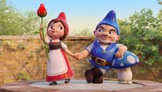 an animated image of two gnomes on a rock with a rose in their hand