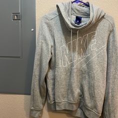 Brand:Nike Color: Gray, White Lettering Size: Medium Condition: Good Explanation: Currently Moving And Selling Unused Clothes. I’ve Probably Only Worn This Once And It’s Been In My Closet Ever Since. Tons Of Wear Left In It And Super Cozy. Open To Offers! Feel Free To Ask Questions. Will Ship Asap! Nike Casual Top With Drawstring Hood, Nike Casual Hoodie Tops, Nike Fall Hoodie Top, Nike Hooded Tops For Spring, Nike Fall Hoodie, Gray Nike Hoodie, Grey Nike Hoodie, Gray Nike, Grey Nikes