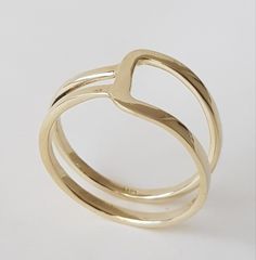 14K solid gold ring in a minimalist style for lovers of geometric shapes. ◈ DETAILS Weight: 3g Width upper part-9mm / 0.35'' Thickness-1.3 mm / 0.05'' ◈ MATERIAL 14K Solid Gold - Smooth,shiny,plain surface ◈ ALSO AVAILABLE IN 14K/18K/9K Yellow, Rose, or White Gold ◈ ENGRAVING is optional ◈ SHIPPING is insured express and free worldwide ◈ GIFT WRAPPING is included with every purchase ✧ Back to my shop for more handcrafted gold jewelry: https://etsy.me/38Cs5Zl If you have any questions, I will be Adjustable Yellow Gold Stackable Rings Modern Style, Modern Adjustable Yellow Gold Stackable Rings, Modern Adjustable Stackable Yellow Gold Rings, Minimalist Formal Stackable Rings With Open Band, Minimalist Stackable Open Band Rings For Formal Occasions, Modern 14k Gold Open Band Ring, Minimalist Formal Stackable Open Band Rings, Modern Stackable Yellow Gold Couple Rings, Modern Open Band Initial Ring For Anniversary