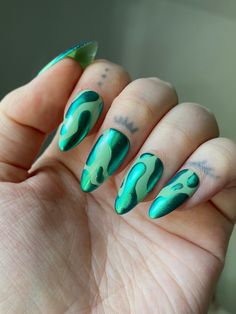 "Hand painted pastel green press on nails with metallic green chrome blobs. Nails pictured are ALMOND MEDIUM. PLEASE READ: Use the nail sizing chart instructions from the photos to measure your nails. Then choose from the nail size options XS, S, M, or L. If your nails do not fit the standard sizes and you need custom sizing, please choose \"CUSTOM\" sizing and type in your custom sizes from thumb to pinky (ie. 1, 2, 3, 4, 5) under the \"personalization\" option. Please choose your length and shape. You can find an example of the lengths and shapes I offer in the photos. Keep in mind that choosing a length or shape different from the nail set pictured may result in different print placement and design, based on how much space the nail shape allows for a design. (For instance, a checkered n Designs On Chrome Nails, Green Chrome Nail Art, Reverse Chrome Nails, Chrome Blob Nails, Funky Green Nails, Green Funky Nails, Colourful Nails Designs, Edgy Winter Nails, Chrome Drip Nails