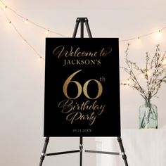 a sign that says welcome to jackson's 60th birthday party with lights in the background