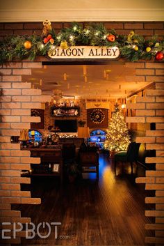 the front entrance to dragon alley with christmas decorations and lights on it's brick wall