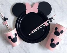 minnie mouse party supplies including cups, straws and napkins