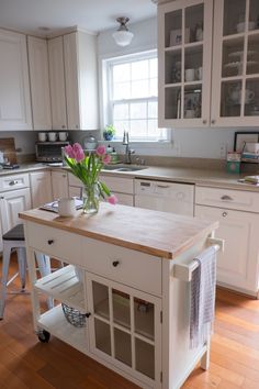 a kitchen island with flowers on it