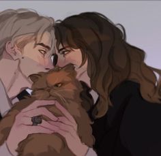 two people are kissing and holding a cat