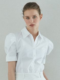 Editor's NotesOUIE's shirt has a feminine and classy mood. You can wear it with any jeans or skirt as a daily look.- Waist line detail- Voluminous pin tuck puff shoulder detail- Mother of pearl buttonsMeasurement (in.)One size- Shoulder: 14.17 in. (20.86 in. puff included)- Bust: 17.71 in.- Sleeve length: 11.02 in.- Total length: 24.01 in.* Model info: Height: 5'8, Bust: 31in. , Waist 22.83 in., Hip 34.64 in. Fitting size:SComposition & Care - 72%Cotton, 28%Polyester- Hand wash with cold water/Dry cleaning- Do not use washing machineDesigner- by OUIE Pin Tucks, Daily Look, Mother Of Pearl, Cold Water, Hand Wash, Sleeve Length, Skirt, Quick Saves