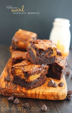 brownies with chocolate chips on a wooden cutting board